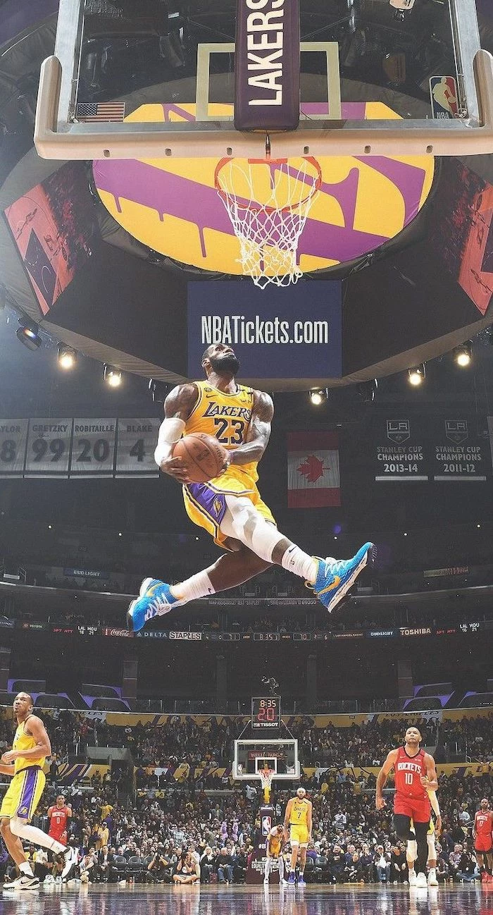 photo of lebron james jumping in the air about to dunk the ball lebron james background