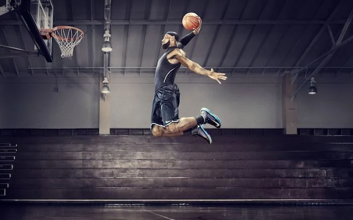 photo of lebron james jumping in the air holding a ball about to dunk it nba wallpaper empty court