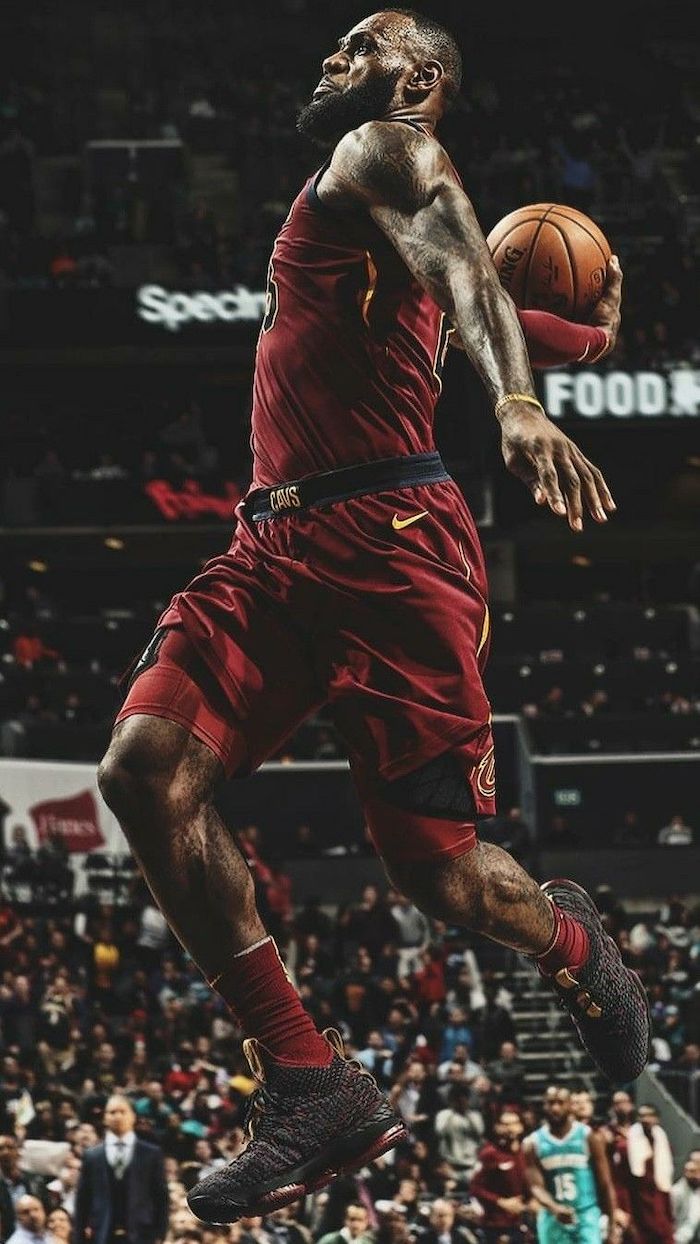 photo of lebron jumping in the air about to dunk the ball lebron james wallpaper iphone wearing cleveland cavaliers uniform