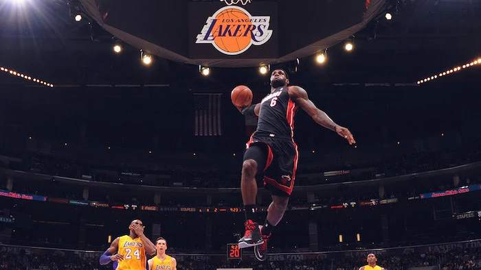 photograph of lebron james jumping in the air wearing miami heat uniform about to dunk the ball lebron wallpaper