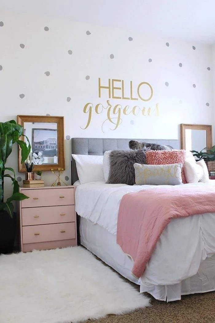 room decor ideas for girls hello gorgeous written with gold letters on white wall with gray dots pink night stand next to the bed with pink white gray throw pillows