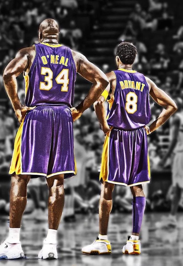 shaquille oneal kobe bryant wearing lakers uniforms standing on the court kobe bryant wallpaper iphone crowd behind them blurred in black and white