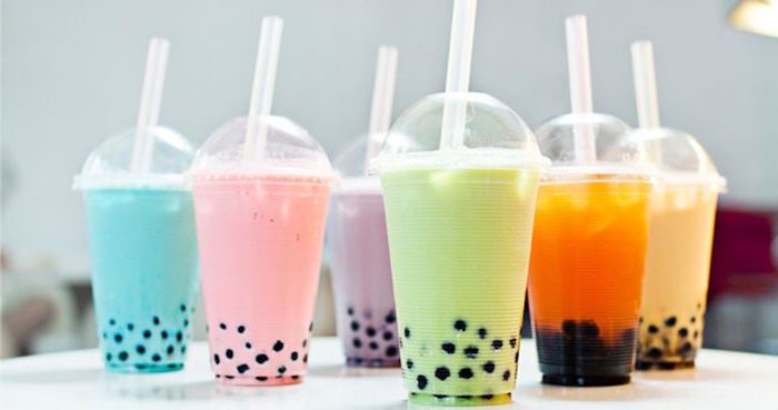six plastic cups filled with bubble tea in different colors what is boba blue pink purple green orange brown