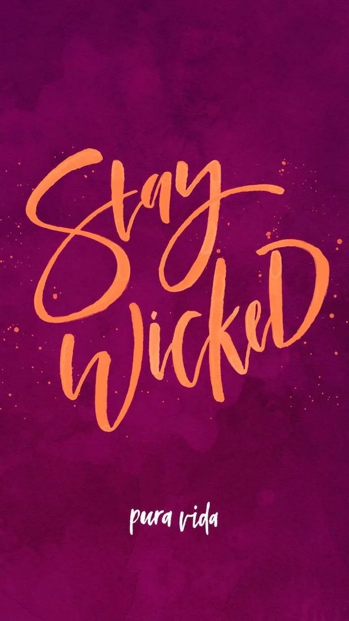stay wicked written with large orange cursive letters halloween desktop backgrounds dark pink background