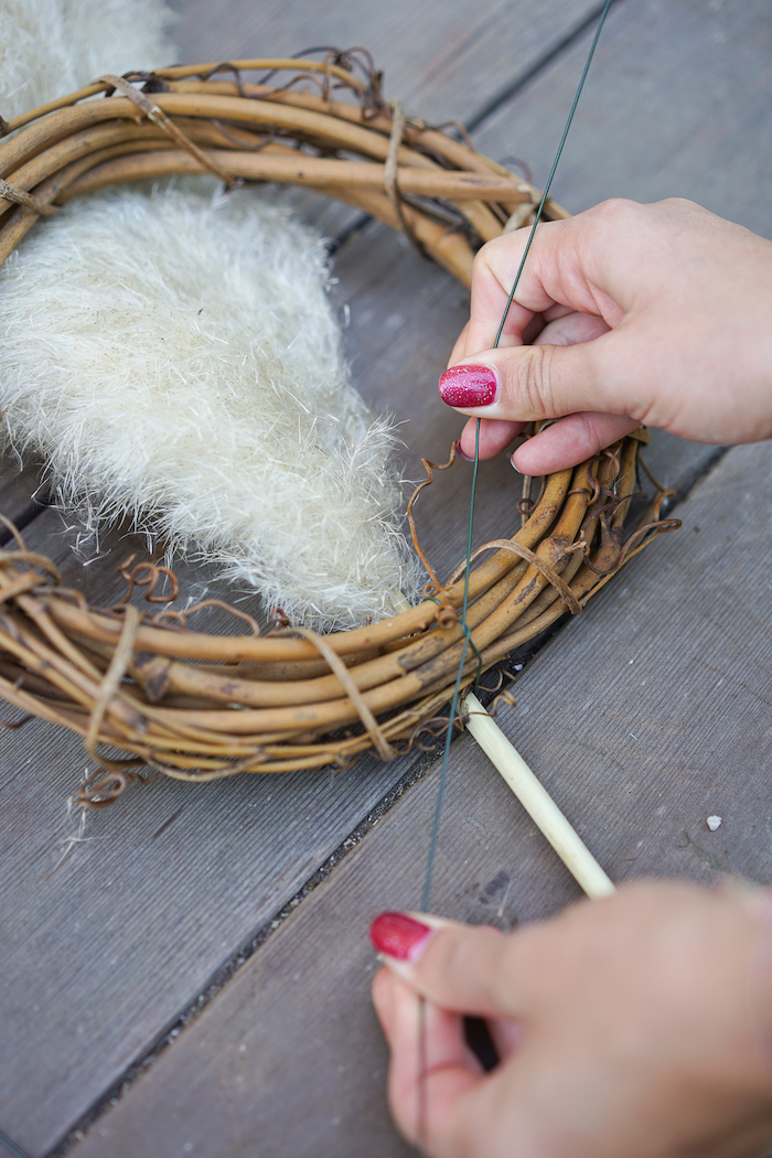 wooden wreath how to dry pampas grass branches being tied to it step by step diy tutorial