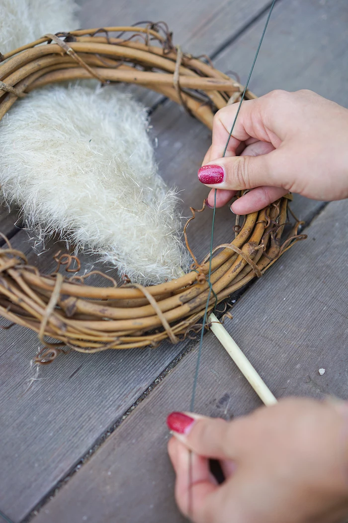 wooden wreath how to dry pampas grass branches being tied to it step by step diy tutorial