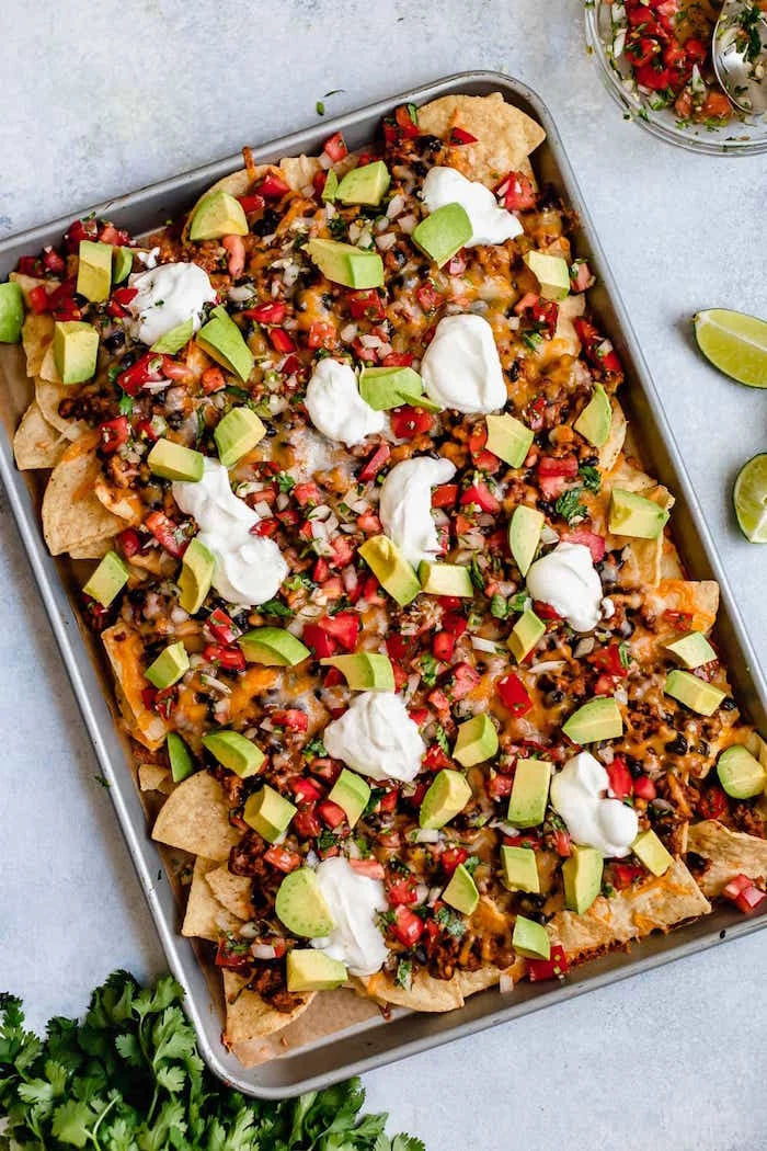 achos baked in sheet pan authentic mexican recipes with corn black beans tomatoes avocado chopped parsley