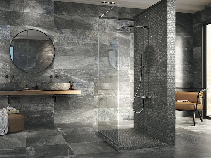 black and gray tiles on the walls and floor bathroom floor tile ideas black mosaic tiles on the shower wall and floor separated with glass