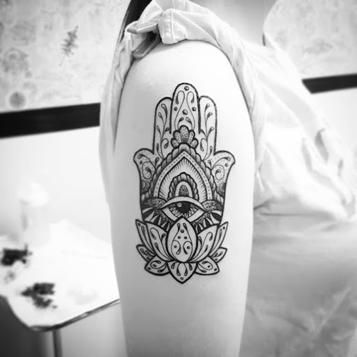 black and white hamsa hand withall seeing eye and lotus flower shoulder tattoo tattoos with meaning of life