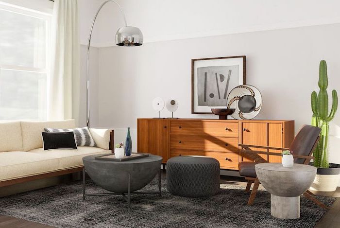 black ottoman and armchair white sofa wooden cabinet mid century modern decor black carpet white walls