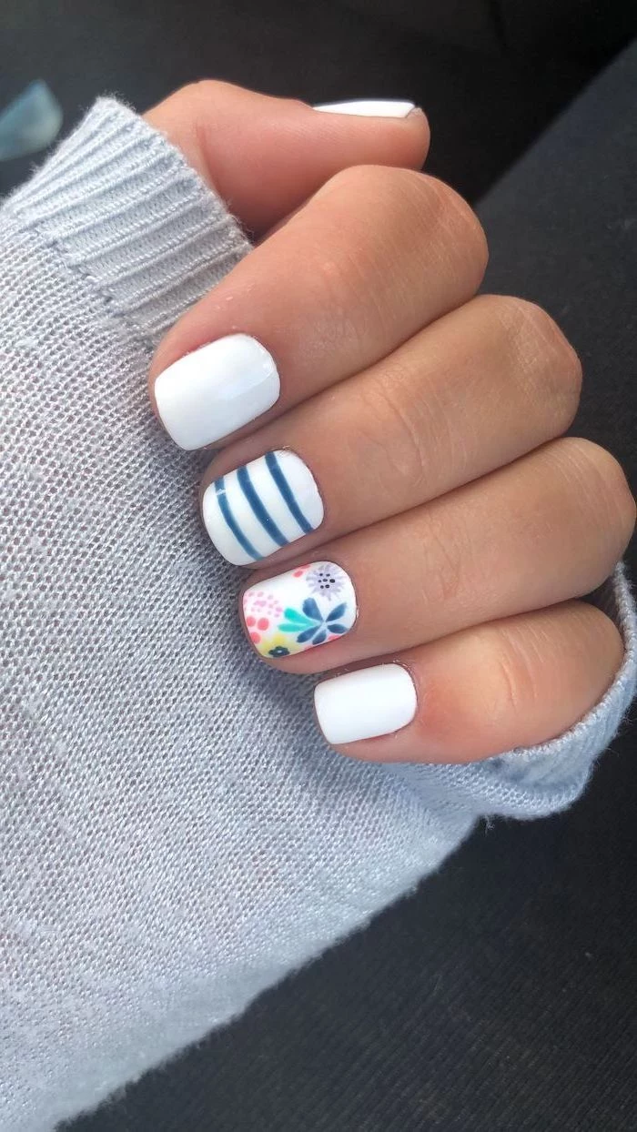 blue and white nail polish on short square nails summer acrylic nail designs flower decorations on ring finger