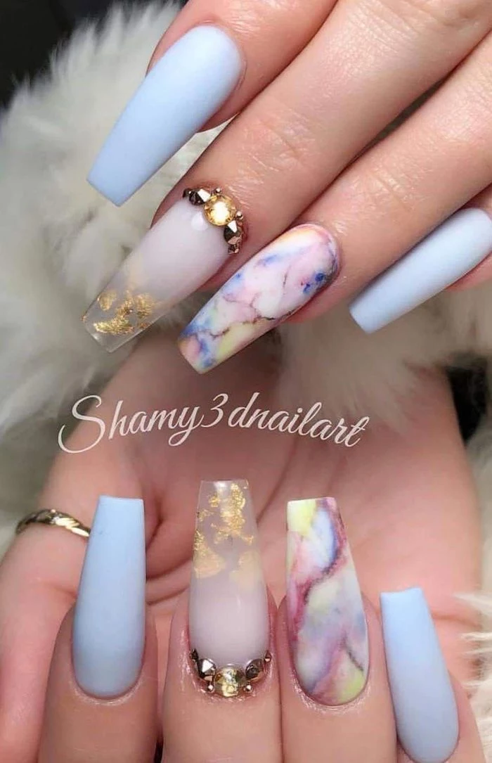 blue matte nail polish acrylic nail ideas decorations with gold leaves rhinestones on middle fingers colorful marble on ring fingers