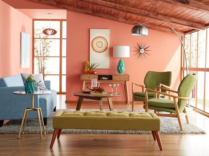 blue sofa green armchairs pink walls wooden ceiling and floor mid century modern house wooden coffee table