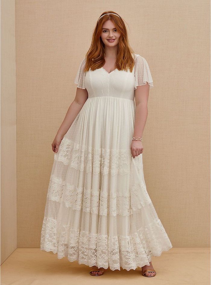 boho wedding dress white lace dress with short sleeves worn by woman with ginger hair wearing beige sandals