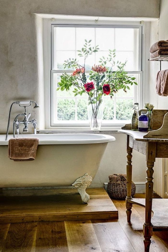 bouquet of flowers on the window frame next to vintage bath country bahtoom ideas wooden floor vanity with open shelving