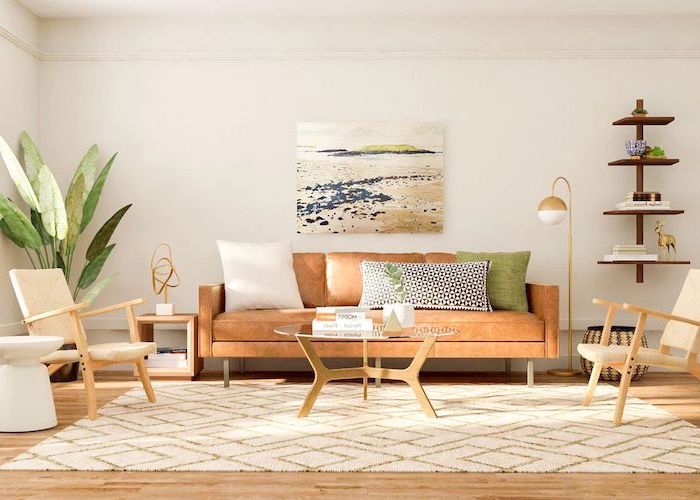 brown leather sofa with throw pillows white armchairs mid century modern decor white carpet on wooden floor wooden bookshelves