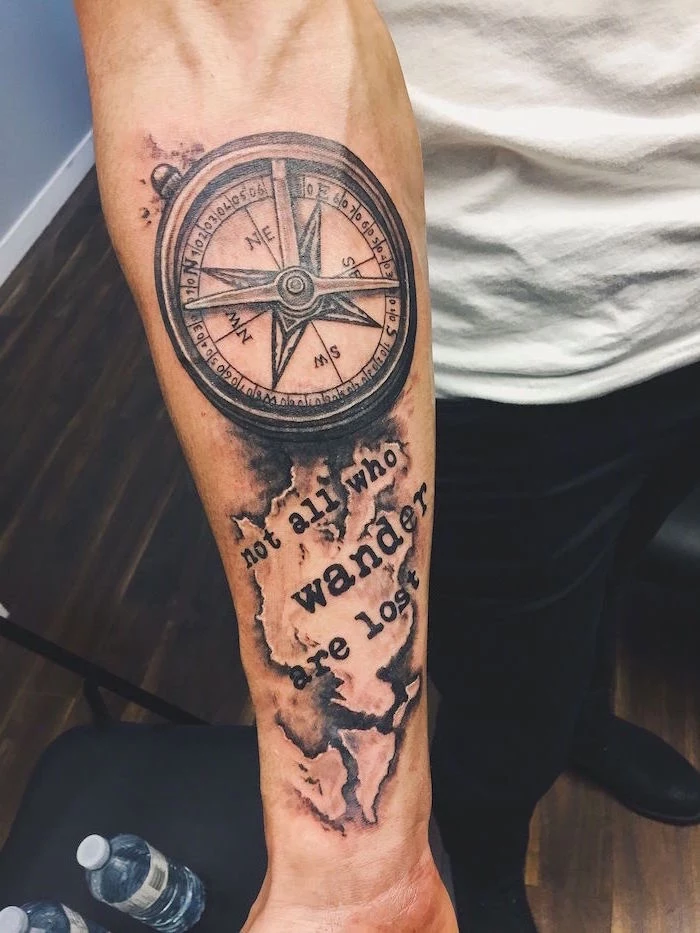 compass forearm tattoo ideas for men not all who wander are lost written under the compass