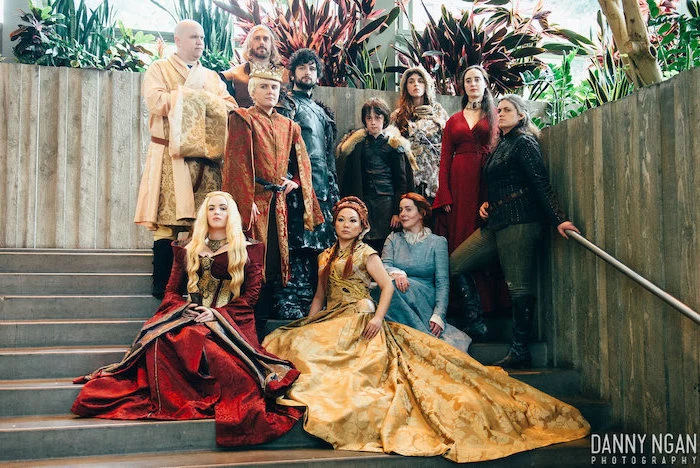 eleven people dressed as characters from game of thrones funny group halloween costumes standing on staircase