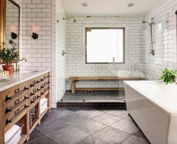 farmhouse bathroom wall decor white subway tiles black tiles on the floor wooden vanity with two sinks marble countertop mirrors above the sink