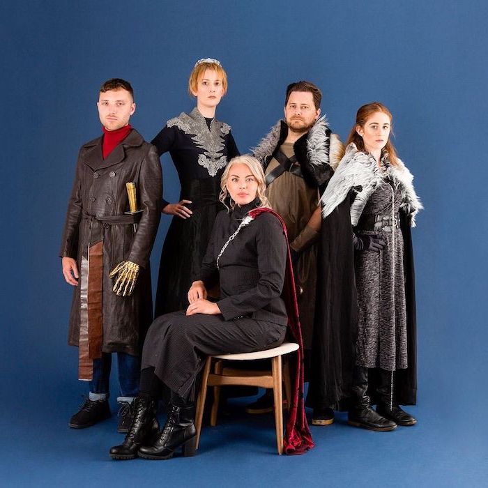 five people dressed as characters from game of thrones group halloween costume ideas photographed on blue background