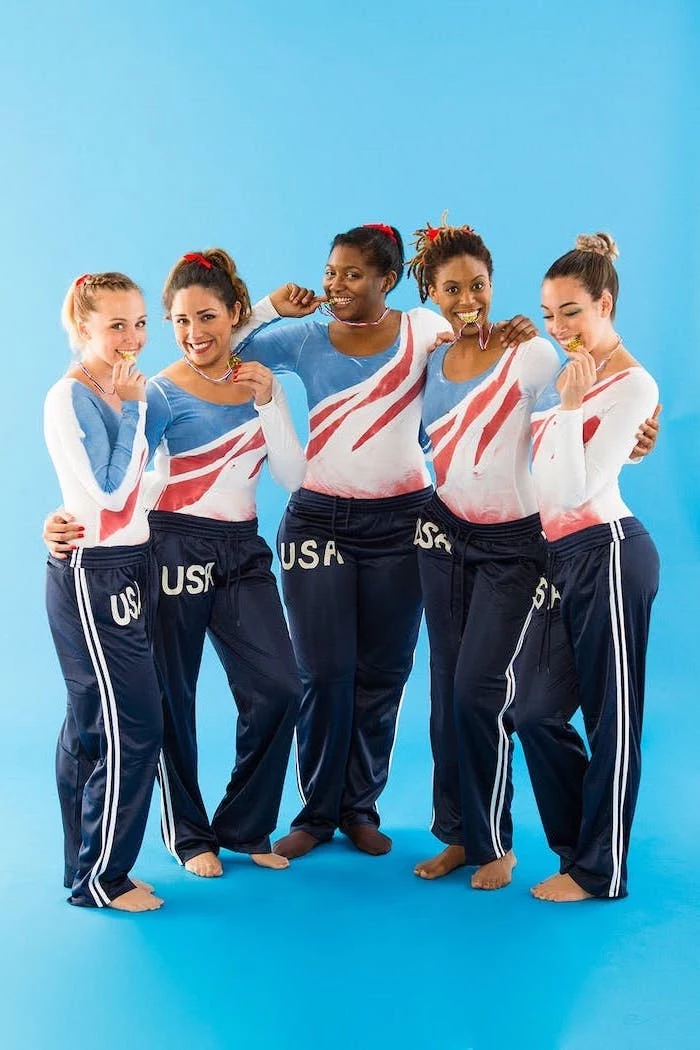 five women dressed as the usa gymnastics team holding the gold medal funny diy halloween costumes