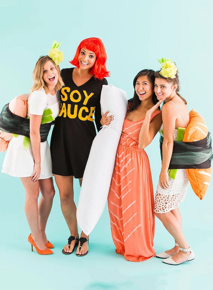 four women dressed as sushi and soy sauce funny group halloween costumes photographed on blue backgorund