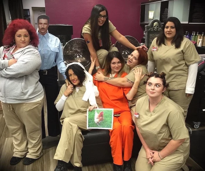 girl group halloween costumes seven women dressed as characters from orange is the new black in prison uniforms