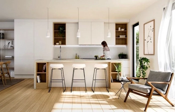 gray armchair on wooden floor what is scandinavian kitchen with kitchen island in all white with open shelving