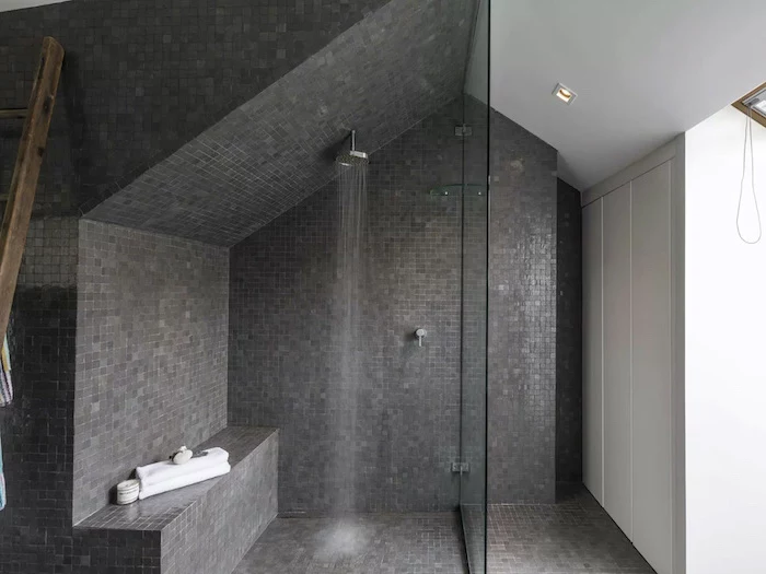 gray mosaic tiles under the shower separated with a glass bathroom wall tile ideas white walls in the rest of the bathroom