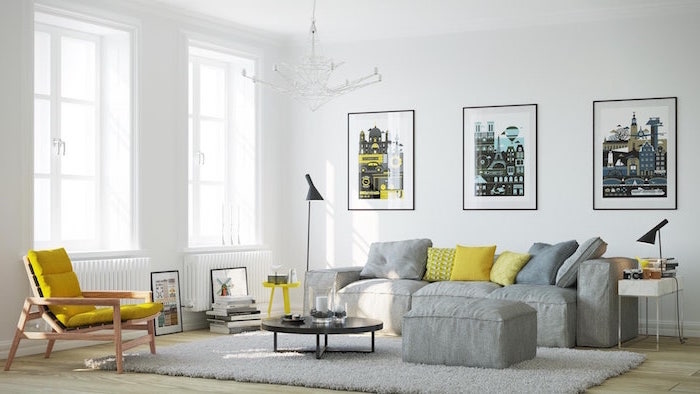 gray sofa and ottoman with gray and yellow throw pillows scandinavian design living room yellow armchair gray carpet