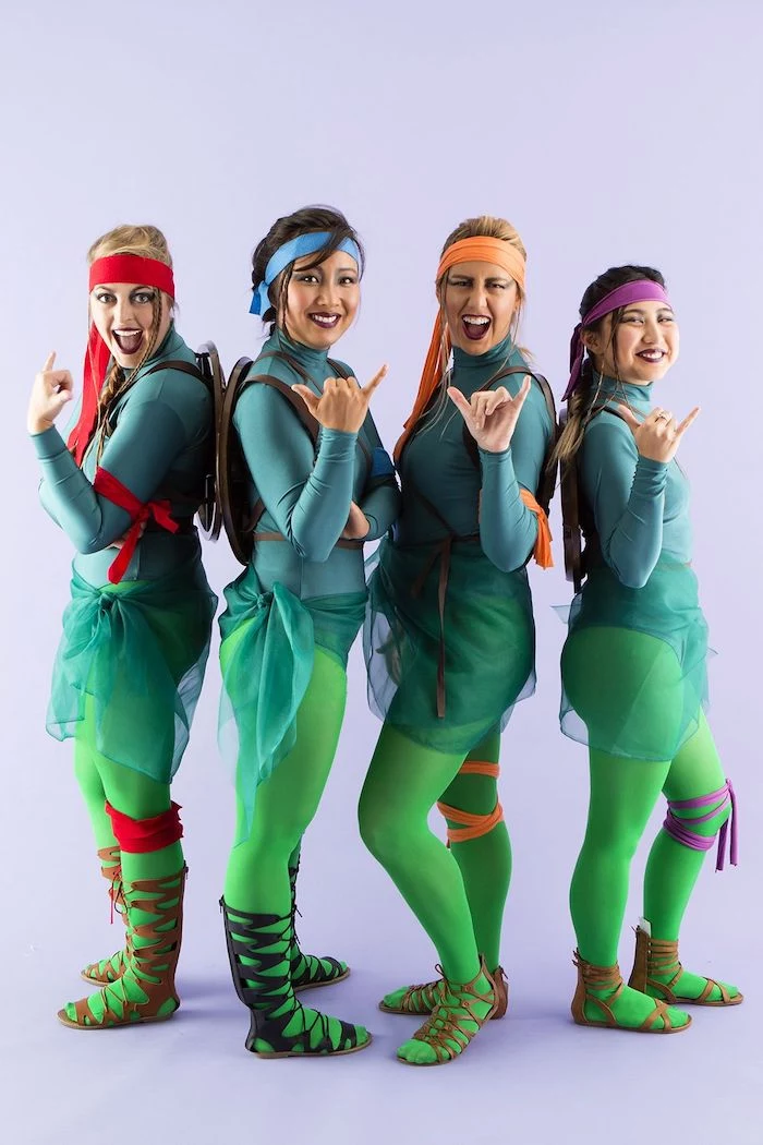 group halloween costumes four women dressed as teenage mutant ninja turtles with green tights and tops bandanas in different colors