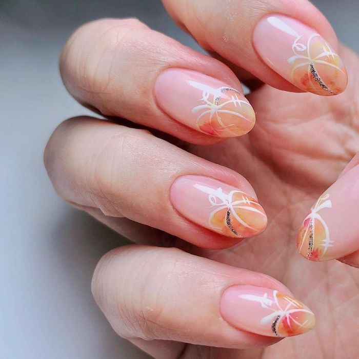 halloween themed nails almond shaped nails watercolor pumpkins with white silhouettes on nude nail polish