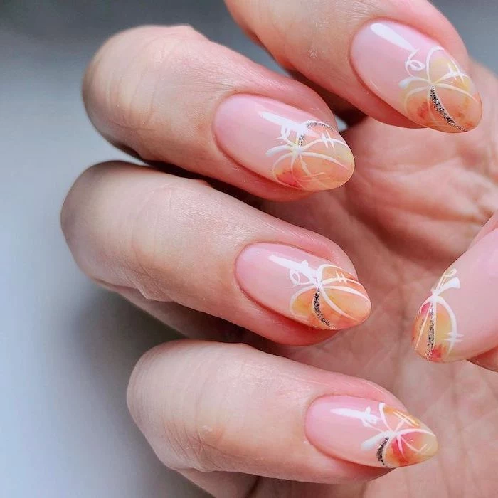halloween themed nails almond shaped nails watercolor pumpkins with white silhouettes on nude nail polish