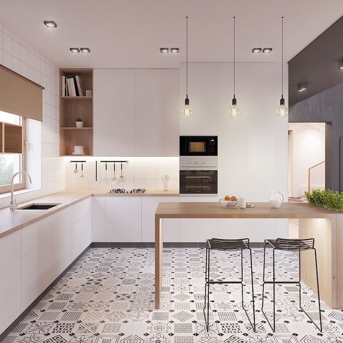 kitchen in all white with white tiles wooden countertops scandinavian furniture black and white patterned tiles on the floor