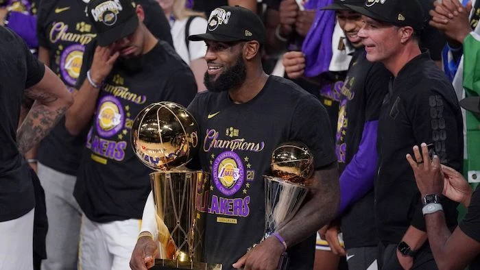 lebron james holding larry obrien trophy finals mvp trophy lakers wallpaper 2020 nba champions los angeles lakers