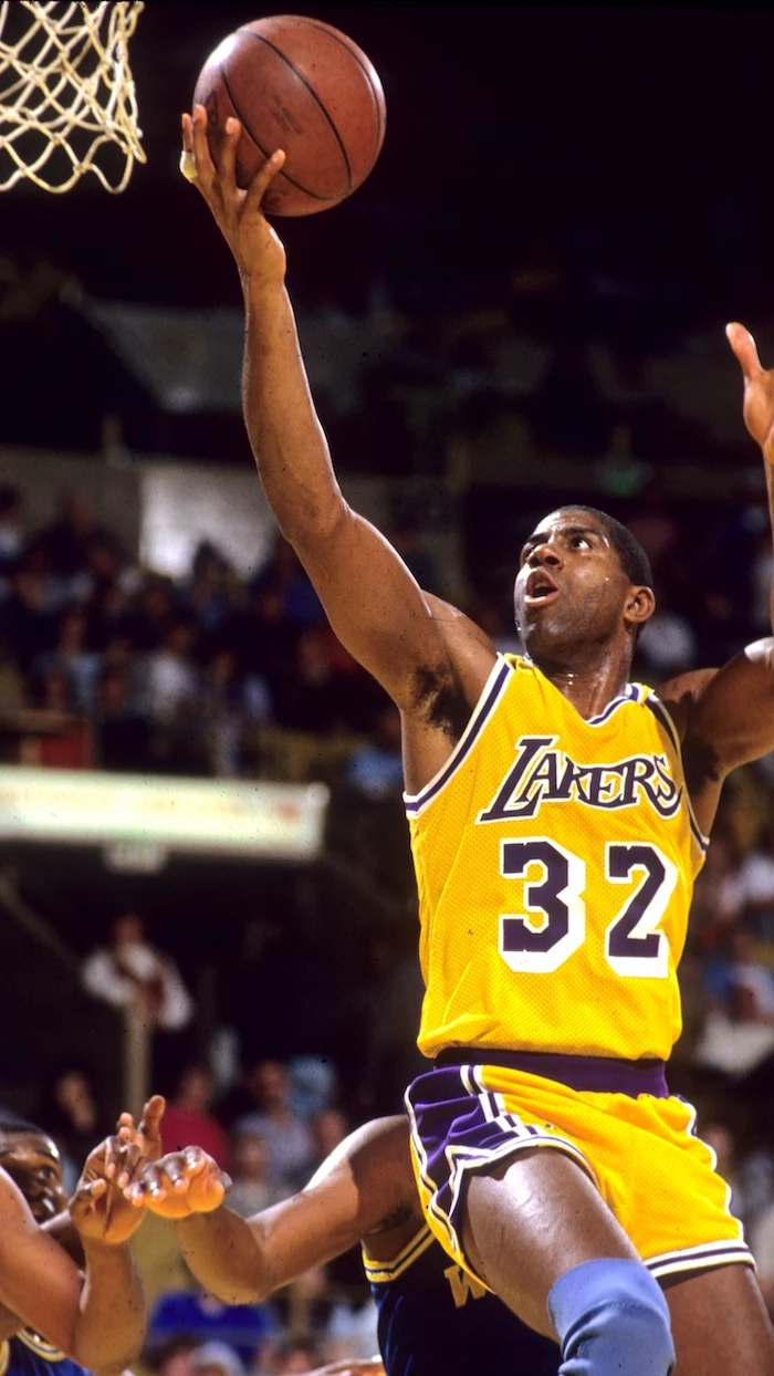 magic johnson photographed on the court wearing gold lakers uniform lakers wallpaper iphone