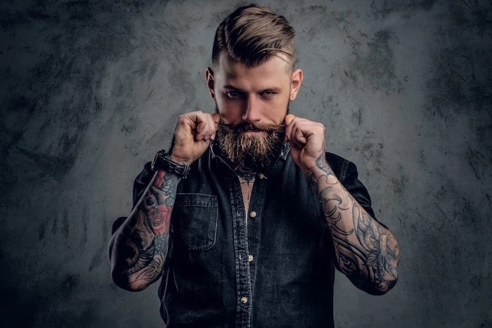 man with beard wearing denim shirt arm sleeve tattoos on both hands tattoo ideas for men gray background