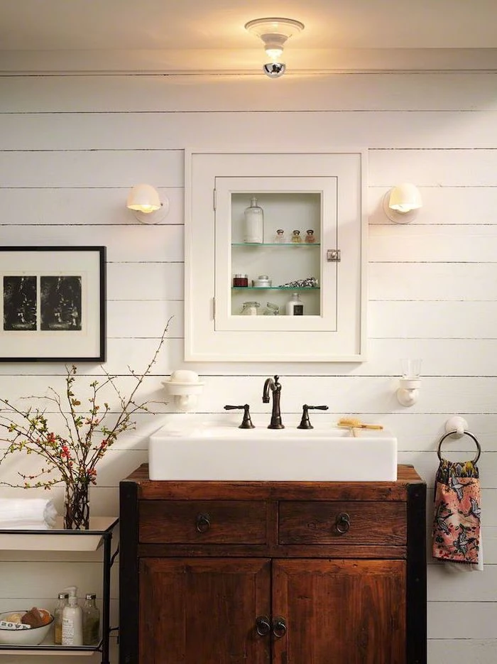 medicine cabinet on wall with white shiplap bathroom decor signs wooden vanity with sink with dark vintage faucet