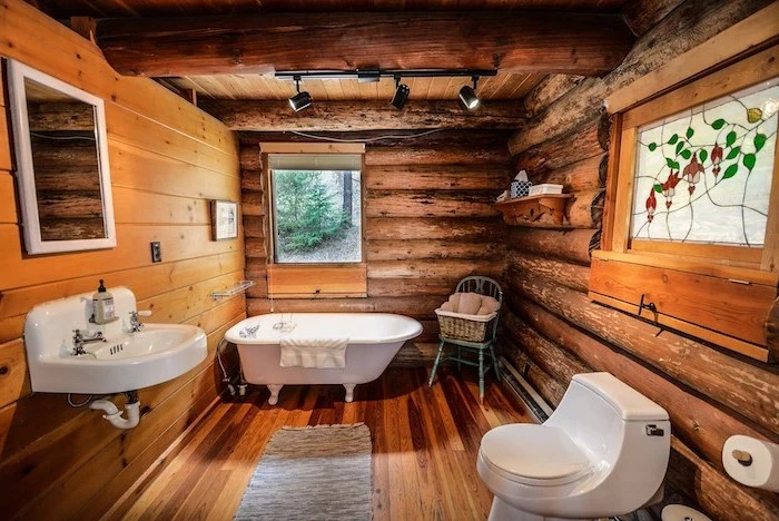 modern farmhouse bathroom vanity all wooden walls floor and ceiling with exposed wood beams
