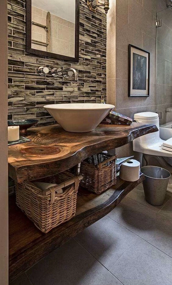 modern farmhouse bathroom wooden shelves with sink mirror above it gray tiles on the floor open shelving
