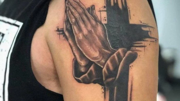 praying hands with all black cross meaningful tattoo ideas for women shoulder tattoo on man wearing black top