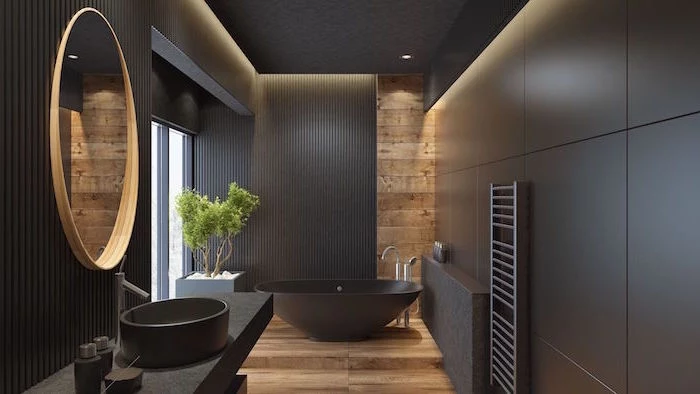 scandinavian minimalism black walls wooden floor and wooden accent behind black bathtub in bathroom