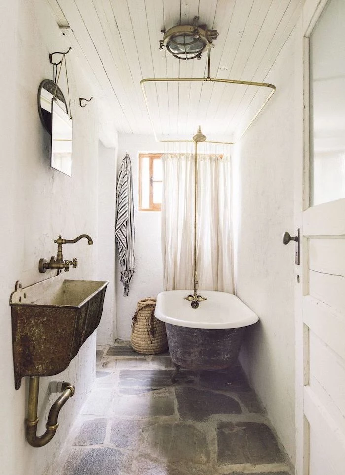 stones on the floor farmhouse bathroom shelves vintage bath and sink white shiplap on the ceiling white walls