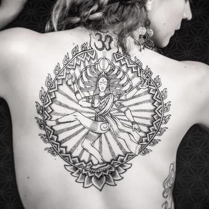 tattoos with meaning of life vishnu goddess inside a circle with om symbol on top lotus flower on the bottom back tattoo