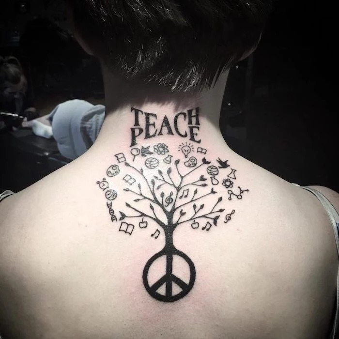 teach peace written above tree with piece sign and different symbols symbols with deep meanings back tattoo