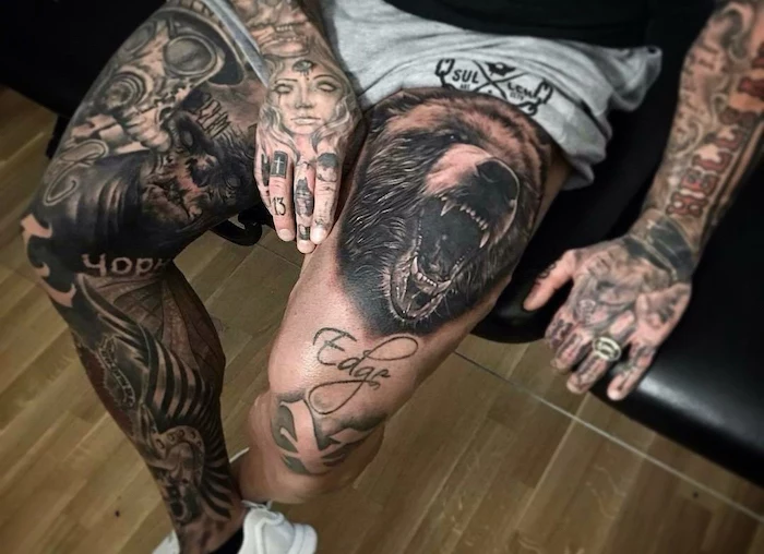 thigh tattoo of roaring bear on man wearing gray shorts sleeve tattoo ideas for men leg sleeve on other leg