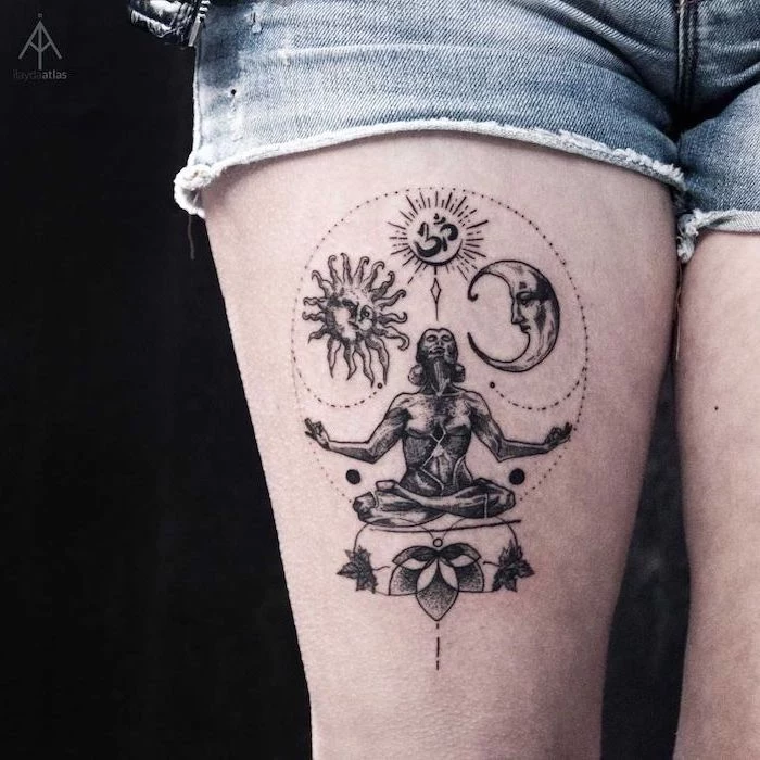 thigh tattoo with om symbol woman meditating sun and moon around it tattoos with deep meaning