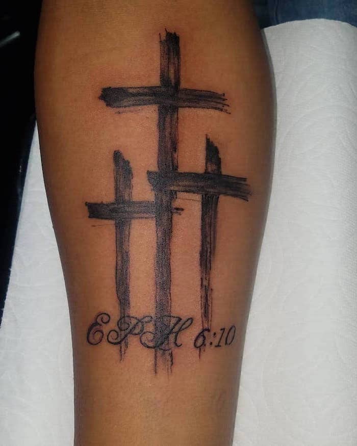 three crosses eph six ten written underneath forearm tattoo tattoos that mean strength bible verse