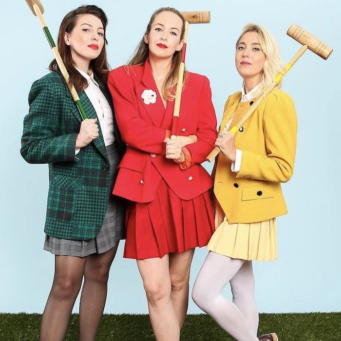 three women dressed as characters from heathers funny diy halloween costumes wearing green red yellow suits