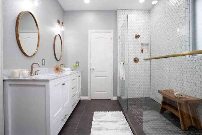 what is scandinavian all white bathroom white vanity with two round mirrors white honeycomb tiles on the wall in the shower